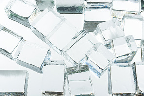 transparent clear square ice cubes on mirror