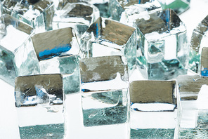 close up view of melting transparent clear square ice cubes