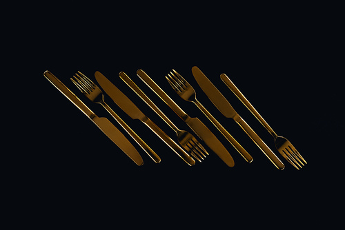 flat lay of metal cutlery isolated on black