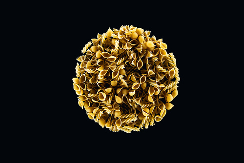 top view of mixed pasta in circle isolated on black