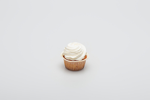 baked tasty cupcake with icing on top on white
