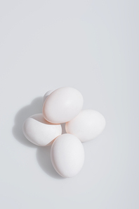 high angle view of fresh eggs in shell on white background
