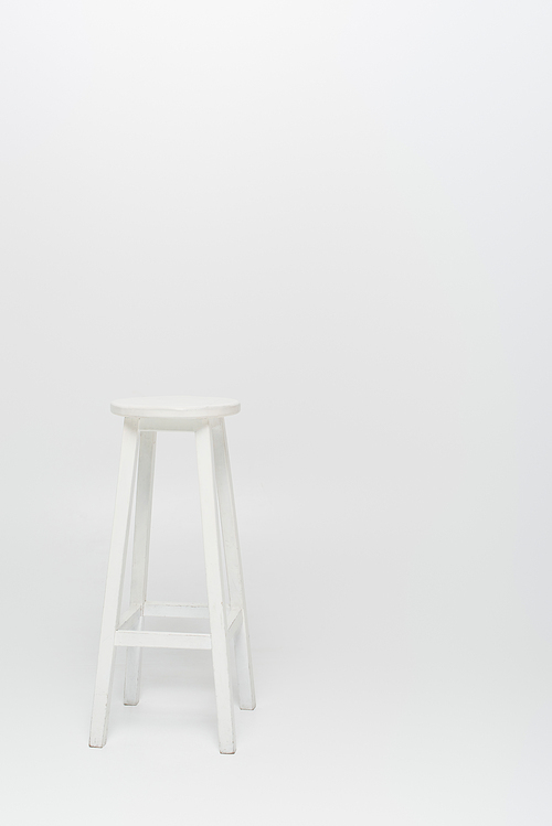high wooden stool on white background