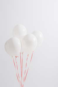 weightless and festive balloons isolated on white