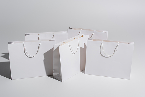 shopping bags with purchases on white