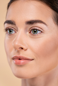 close up portrait of young woman with perfect skin isolated on beige, beauty concept