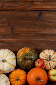 many orange pumpkins on wooden background ,  concept , top view with copy space