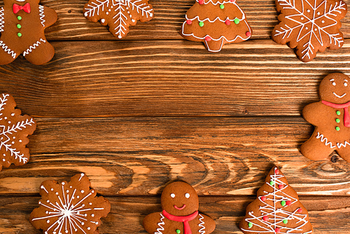 flat lay with gingerbread cookies on wooden surface
