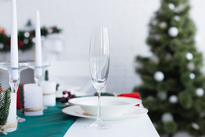 selective focus of champagne glass on table served for christmas dinner