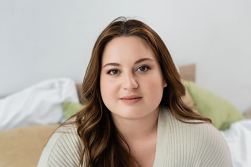 Pretty body positive woman  in bedroom