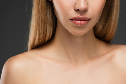 close up view of cropped young woman with perfect skin isolated on grey