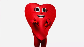 person in red heart costume showing thumbs down isolated on white