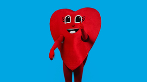 person in positive heart costume showing like isolated on blue