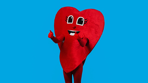 person in joyful heart costume showing thumbs up isolated on blue