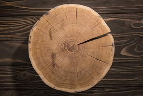 top view of wooden cutting board on brown table
