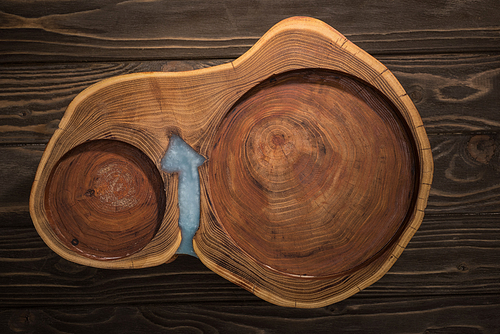 top view of wooden cutting boards on brown table