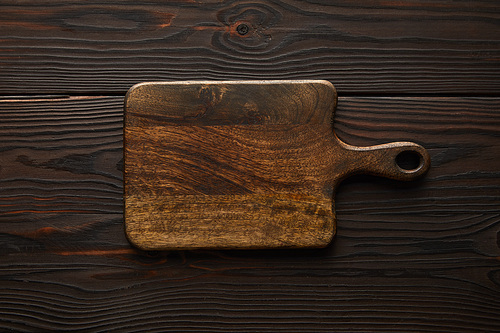 top view of wooden and empty cutting board with copy space
