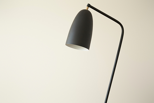 black modern lamp against white wall