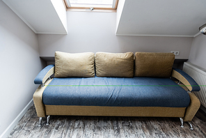 soft pillows on modern sofa in living room