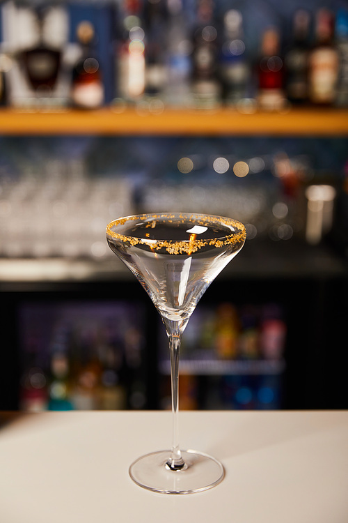 margarita glass with brown sugar on white bar counter