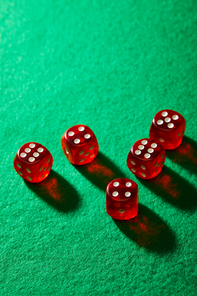 High angle view of red dice on green background