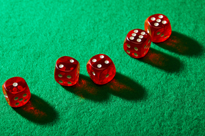 High angle view of dice on green background
