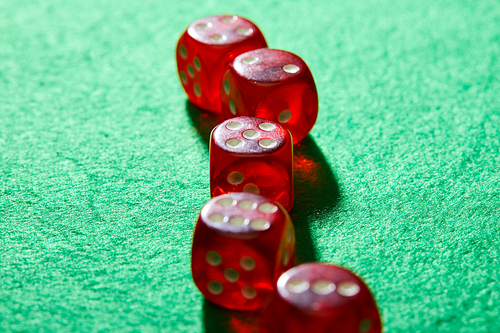 Selective focus of dice on green background
