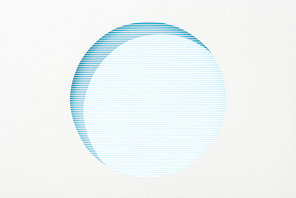 cut out round hole in white paper on striped blue background