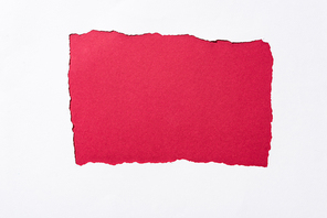 red colorful background in white torn paper hole