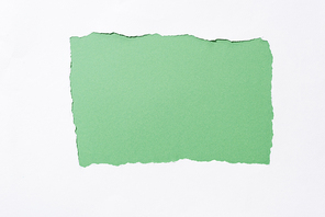 green colorful background in white torn paper hole