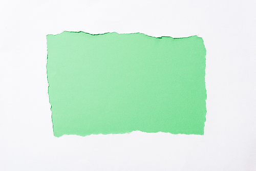 bright green colorful background in white torn paper hole