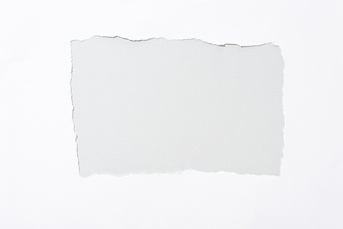 grey background in white torn paper hole