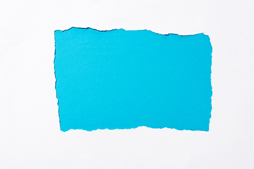 blue colorful background in white torn paper hole