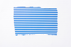 blue striped colorful background in white torn paper hole