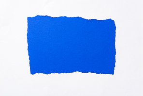 bright electric blue colorful background in white torn paper hole