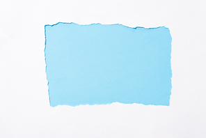 light blue colorful background in white torn paper hole