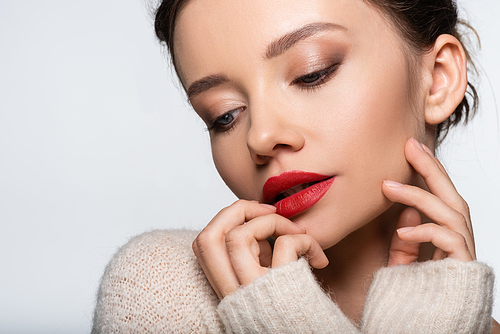 Young woman with red lips posing isolated on white