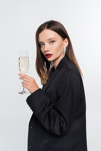 young brunette woman with champagne glass  isolated on grey