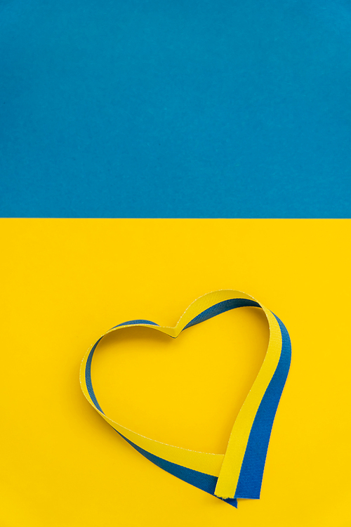 Top view of ribbon in heart symbol on ukrainian flag