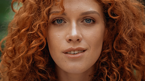 close up of curly redhead woman 
