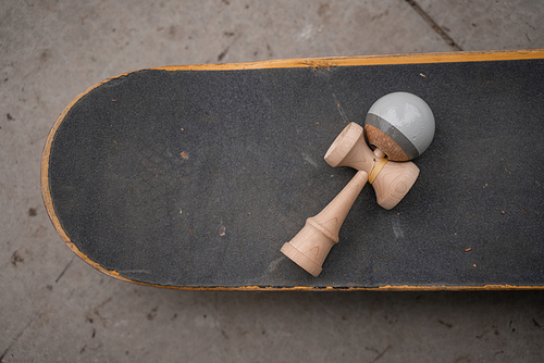 top view of assembled kendama game on skateboard