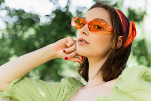 Low angle view of woman in sunglasses  outdoors