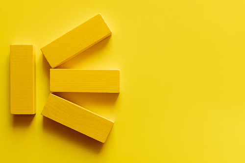top view of bright colored blocks on yellow background