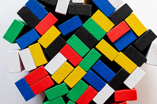 top view of tetragonal multicolored blocks on white background