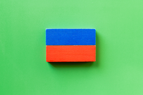 top view of blue and red rectangular blocks on green background