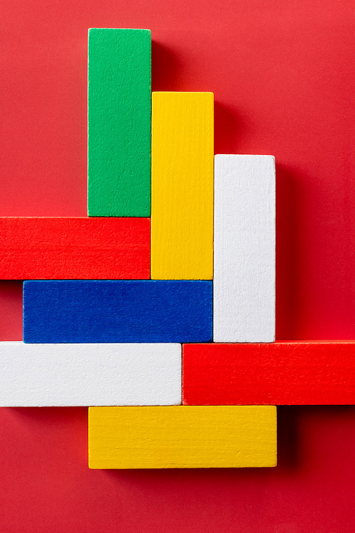 close up view of red, white, blue, yellow and green blocks on bright background