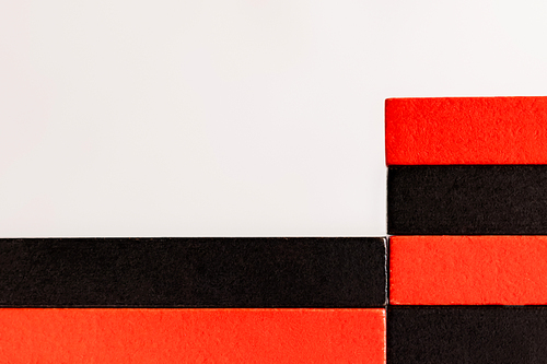 close up view of rectangular red and black blocks isolated on white