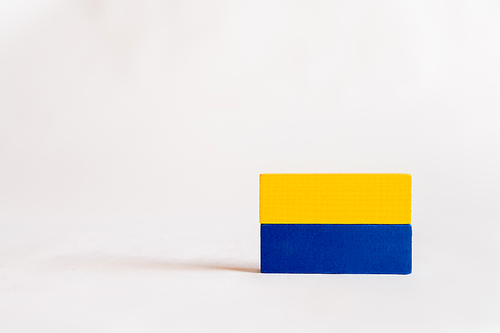 blue and yellow rectangular blocks on white background with copy space, ukrainian concept