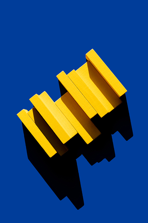 yellow blocks on blue background with shadow, top view, ukrainian concept