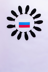 Top view of russian flag and frame from paper bombs on white background